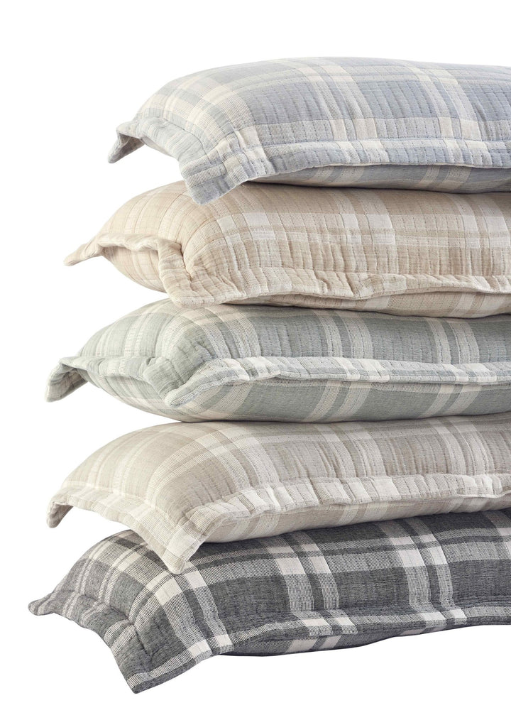 TP-118-1640_3|Angled view of a stack of cozy plaid pillows in various neutral tones and patterns. Comfortable and stylish home bedding.