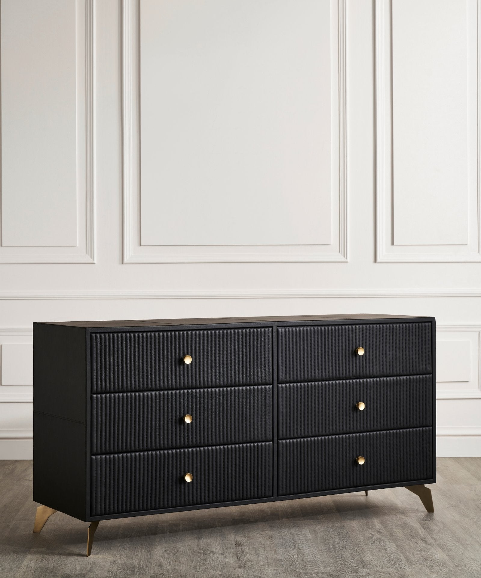 FN-5202-642033_4|Angled view of a sleek black modern dresser with textured fluted fronts, six drawers, and chic gold hardware.